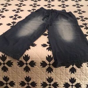 Dark Denim with white patches on the front. Very soft material.